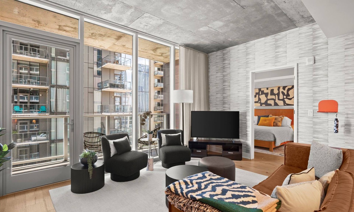 Rainey Street Historic District Condo | Designer Condo Steps to Lady Bird Lake with gym & rooftop pool