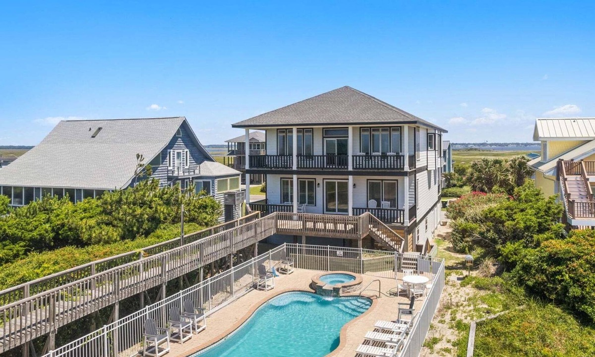 Caswell Beach House | Discover Peace on the Beach, a stunning 6BR, 5BA oceanfront retreat in Oak Island.