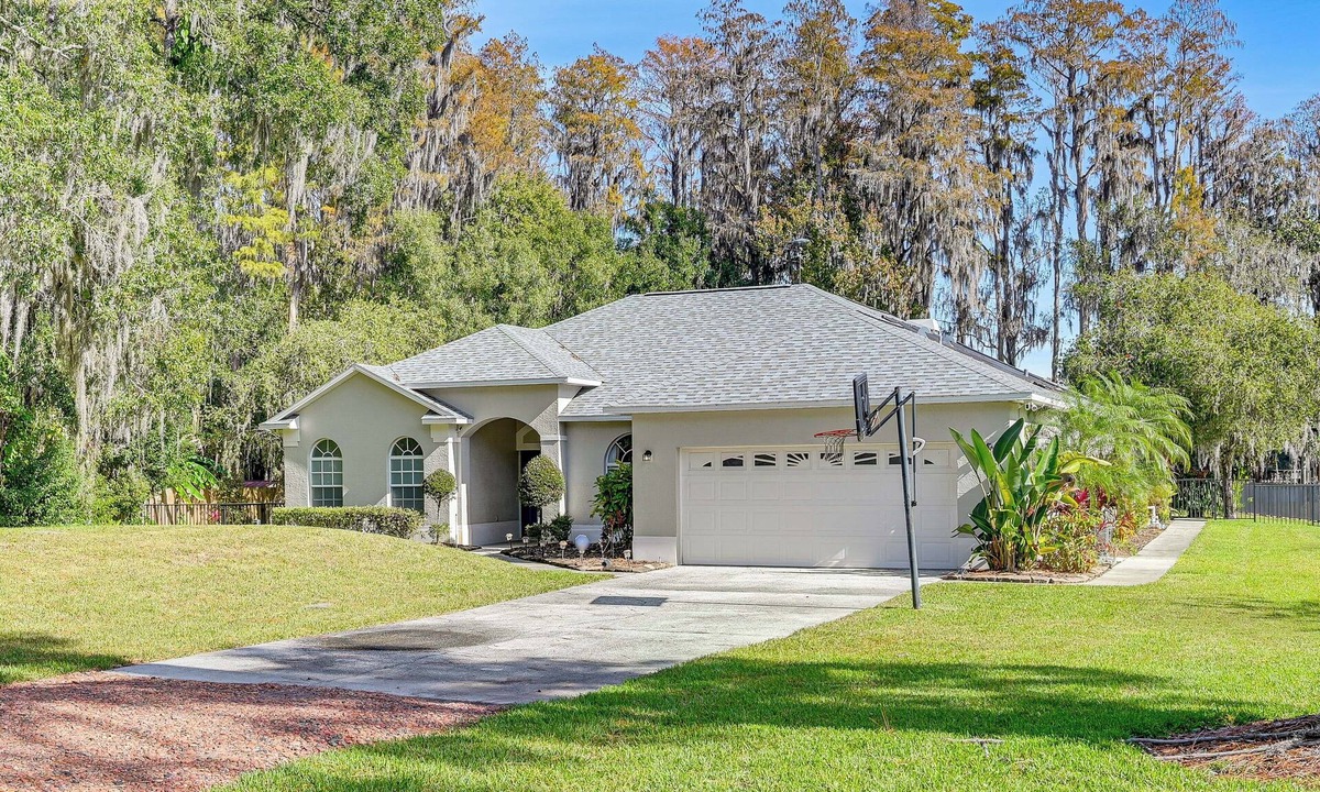 Land O' Lakes House | Dock, Lanai & Pool! Modern Red Bug Lake Retreat