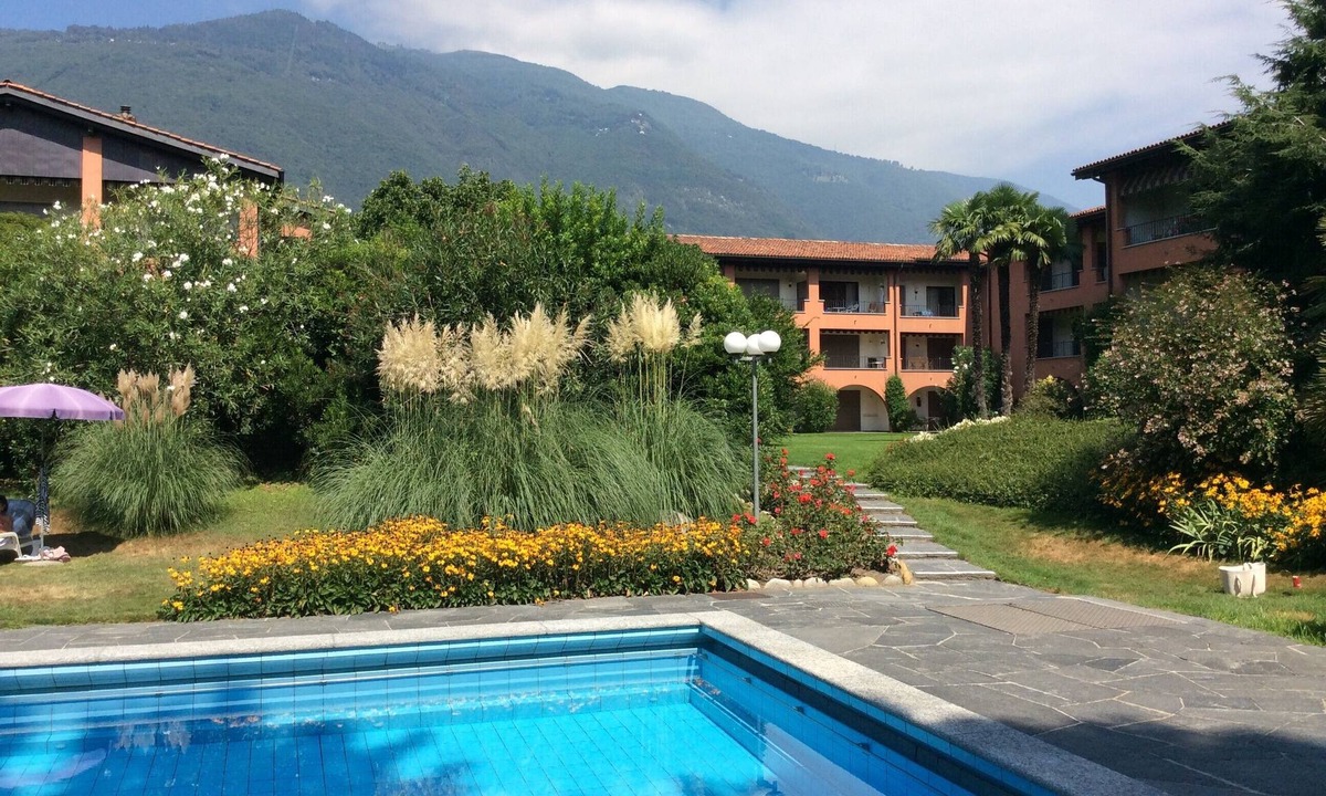 Ascona Apartment | Duplex apartment in well maintained residence with pool and sunbathing area