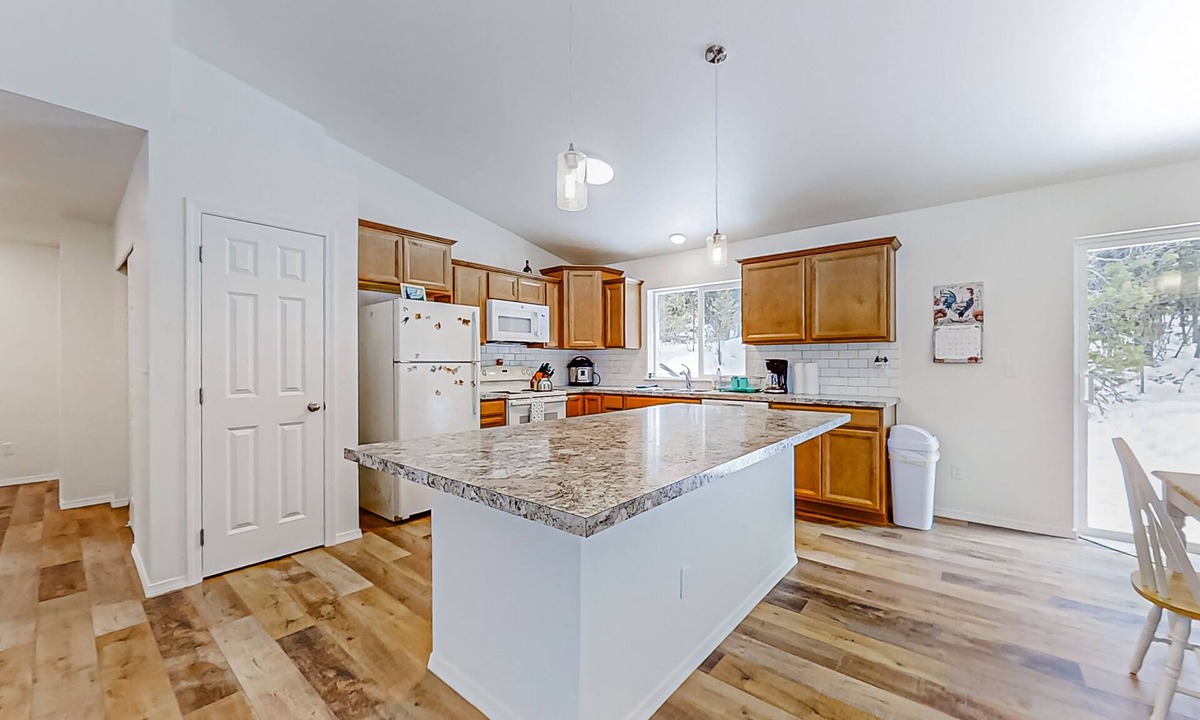 Crescent House | Enchanting 10-acre retreat with waterfront views & spacious deck