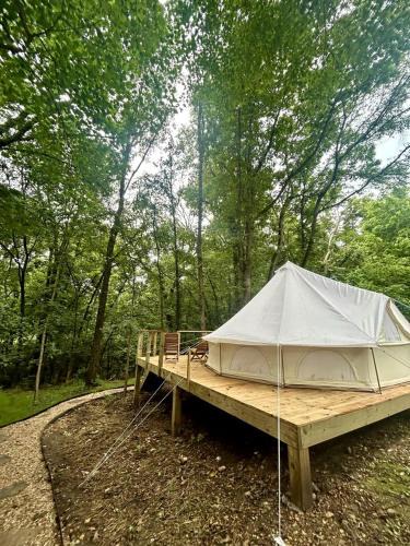 Gentry House | Enchanting Mountain Glamping Tents with Elevated Decks and Fire Pit Near Gentry, AR