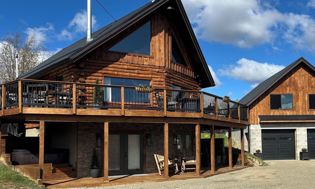 Swain House | Enjoy an updated classic log cabin with ski slope views from the hot tub.