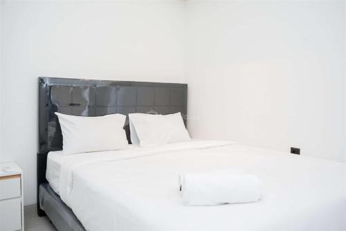 Pagedangan Apartment | Enjoy Living 2BR Apartment at Carstensz Residence By Travelio