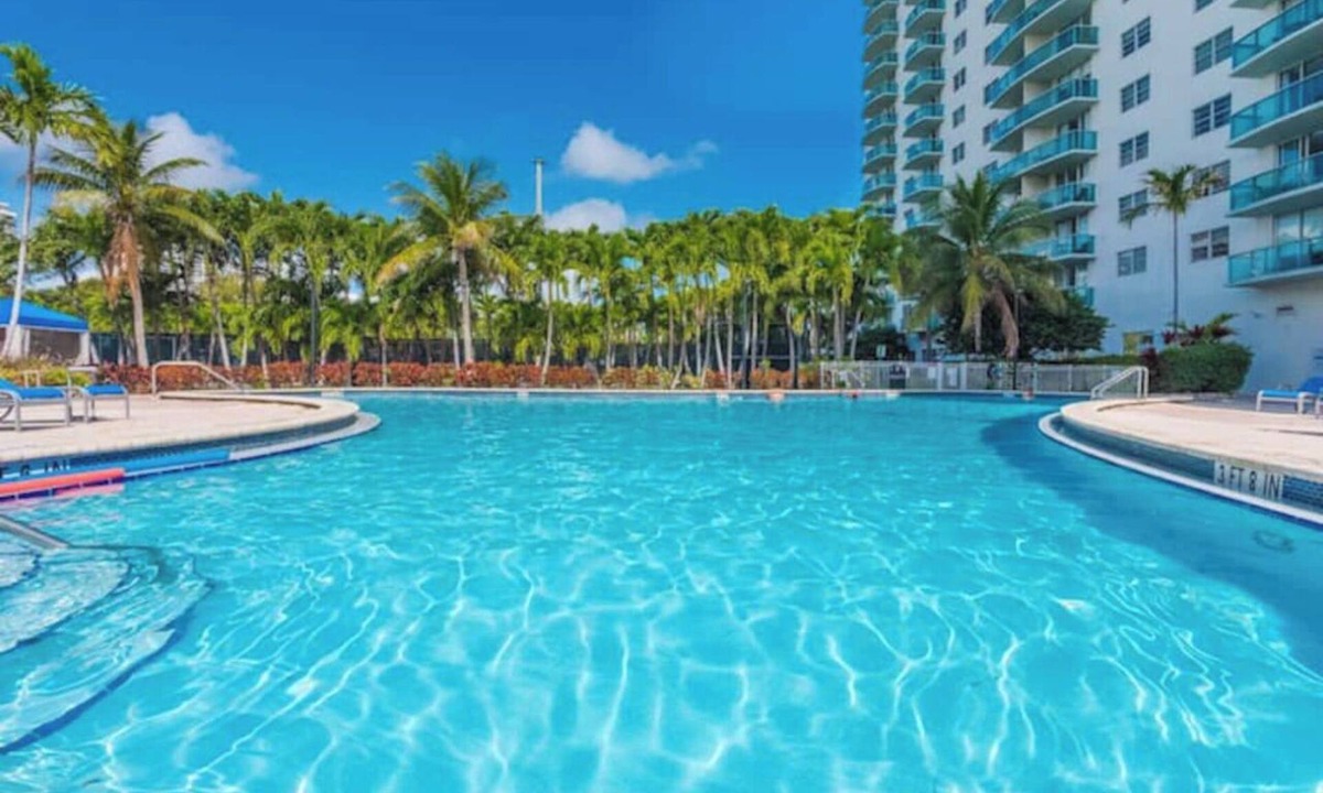 Golden Beach Condo | Entire condominium with a pool view, steps from the beach