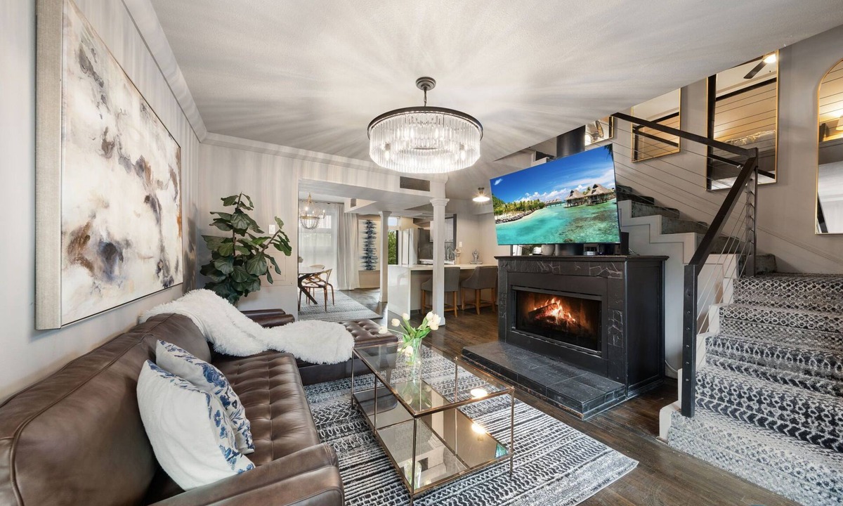 Old East Dallas Condo | Expansive 2-bed loft with fireplace, full kitchen, smart TVs, sofa bed, and access to an award-winning courtyard & resort pool.