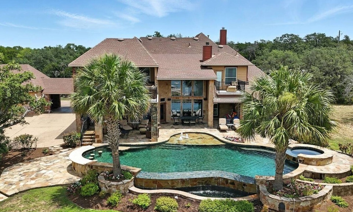 Rocky Ridge House | Experience luxury on Lake Travis! Enjoy stunning lake views, a private pool, spa, fire pit, and plenty of space for the whole crew. This gated retreat sleeps 17+ and features a chef’s kitchen, bar, media room, game room, dedicated office, playscape,
