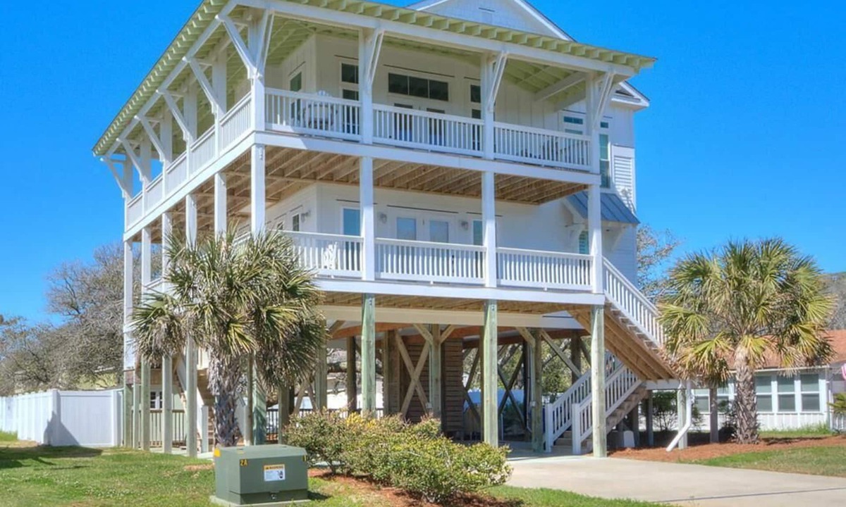 Yaupon Beach House | Experience ocean views at Blue Waves, a spacious 4-bedroom home in Oak Island!