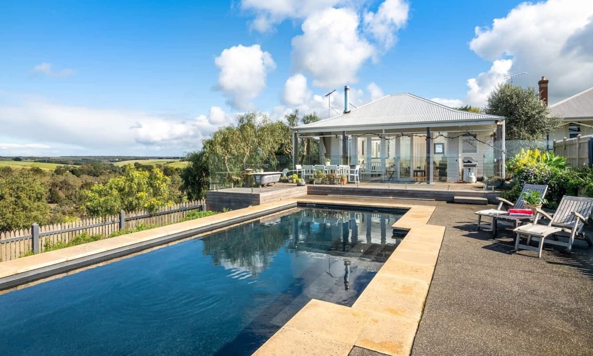 Bellbrae Apartment | Fireside Bliss Poolside Escape with Cosy Comforts
