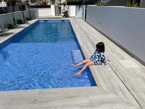 Santiago de la Ribera Apartment | Frontsea Beach bungalow with swiming pool and long terrace