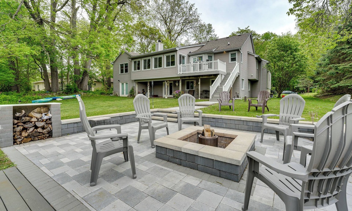 Commerce Township House | Game Room & Fire Pit: Canal-Front Commerce Home