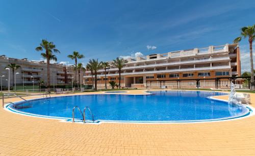 Playa de Almarda Apartment | Global Vacacional, Planta baja con piscina en Almenara