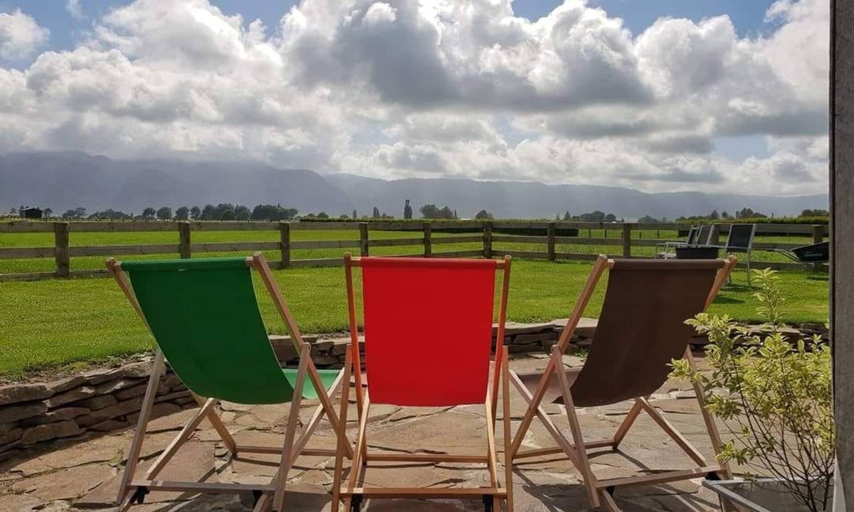 Richmond Downs House | Handhewn Barn in a field