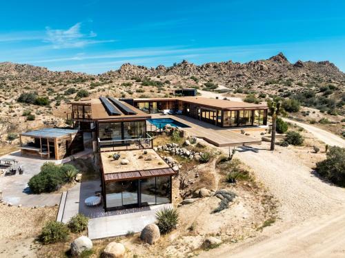 Yucca Valley Villa | Iconic 7,000sf Glass Villa with 2 Pools on 350 Acres