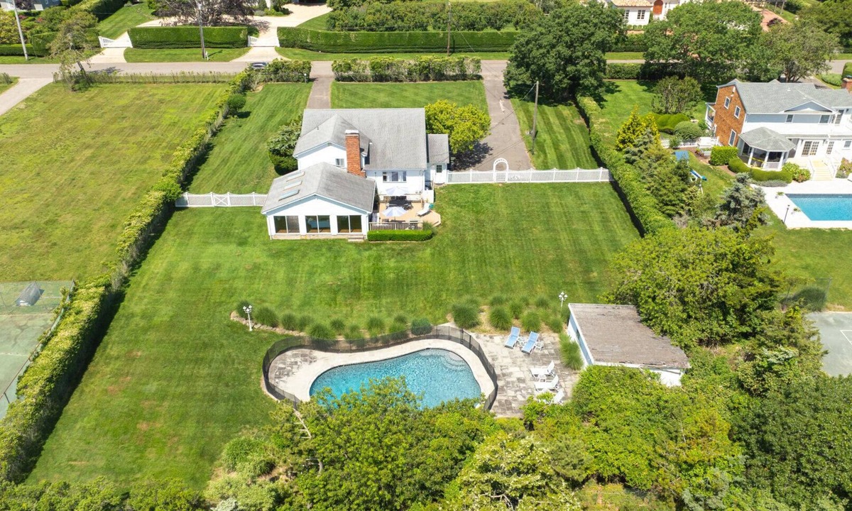 Westhampton Beach House | Idyllic traditional home with spacious rooms, fenced yard, and private pool.