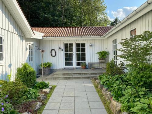 Viborg House | Idyllically Situated Wooden House By The Forest