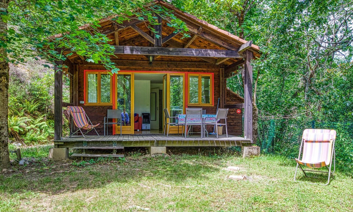 Mirandol-Bourgnounac House | In idyllic location of a forest and near the river Vaur is this cozy wooden house.