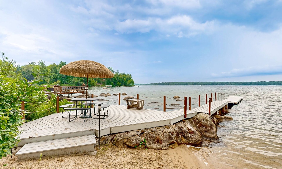 South Casco House | Inviting lakefront home with private dock, sandy beach, and stunning views