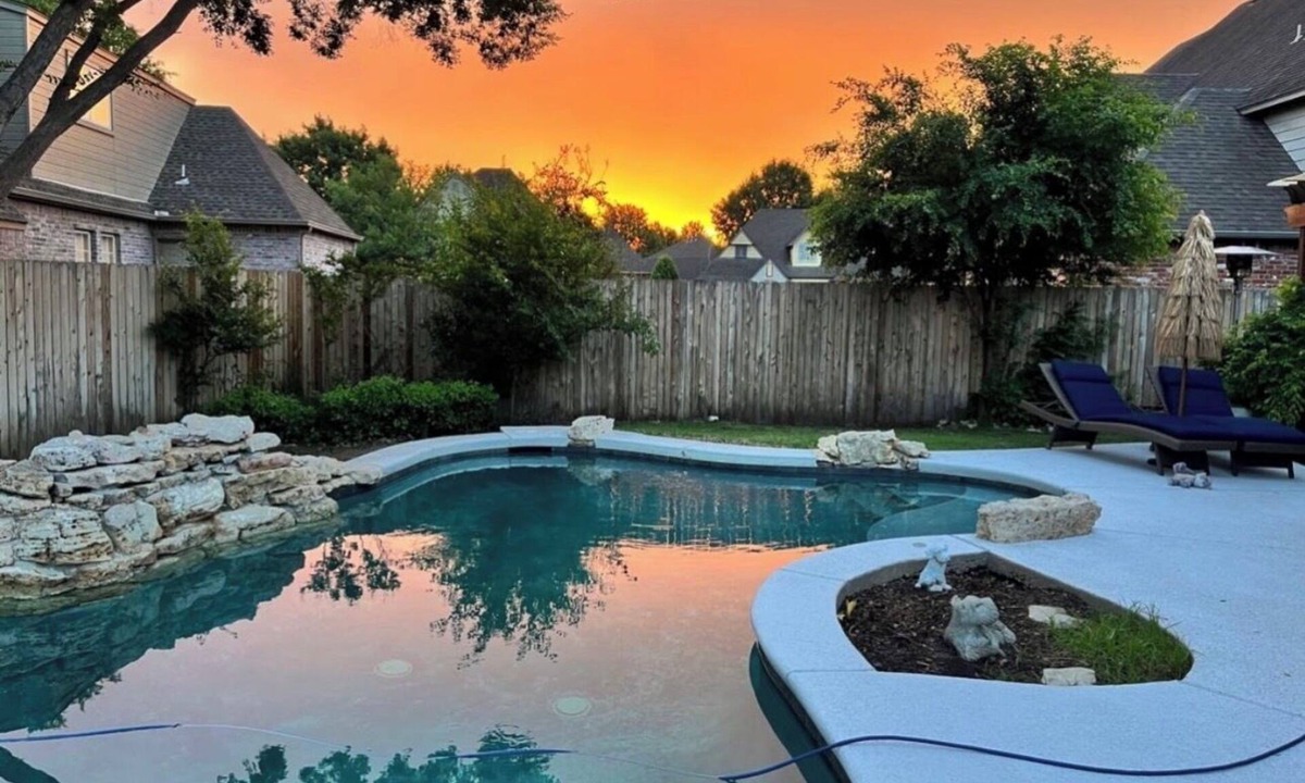 South Tulsa House | King Room w/ensuite downstairs. 3 Q rooms and full bath upstairs. Luxury kitchen w/giant island, wine cabinet w/sink, Breakfast Rm seats 6. Dining Rm seats 8. Half bath, Patio w/outdoor table, sofa and TV. In-ground pool, pool table, doggie door