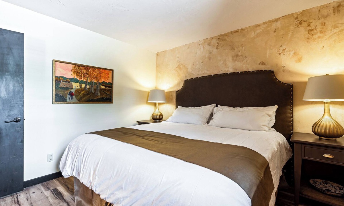 Taos Apartment | King Suite, kitchenette, private fenced patio with shared laundry and sauna on site.