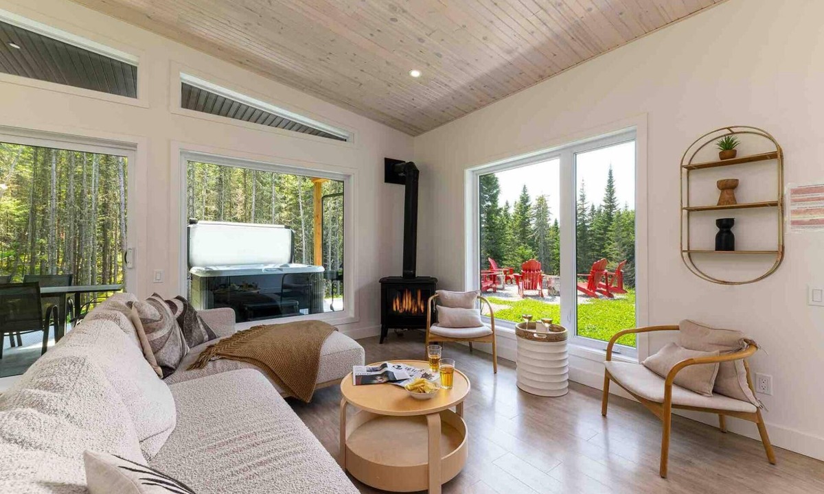 Baie-St-Paul Ski Chalet | La Charlebois 24: Forest Views, Hot Tub & Patio