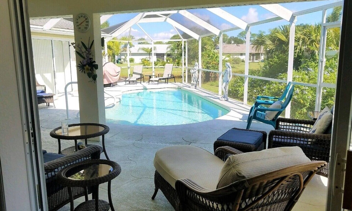 Pebble Beach House | La dolce vita awaits in this immaculate pool home on fresh water canal.