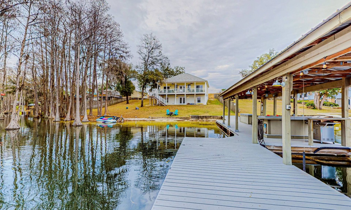 Marianna House | Lakefront home with amazing sunset/water view, private dock, & firepit