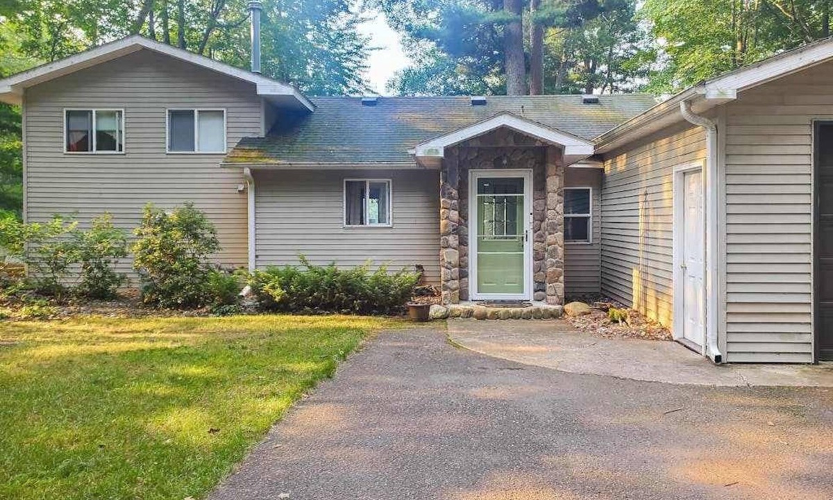 Arbor Vitae House | Lakefront home with large patio, fire pit, W/D & WIFI