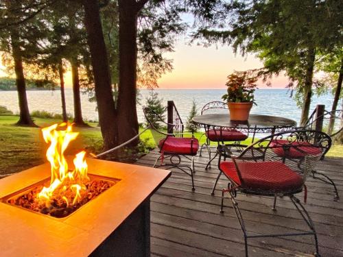 Sodus House | Lakefront Pine Cottage Hot Tub & Fire Pit