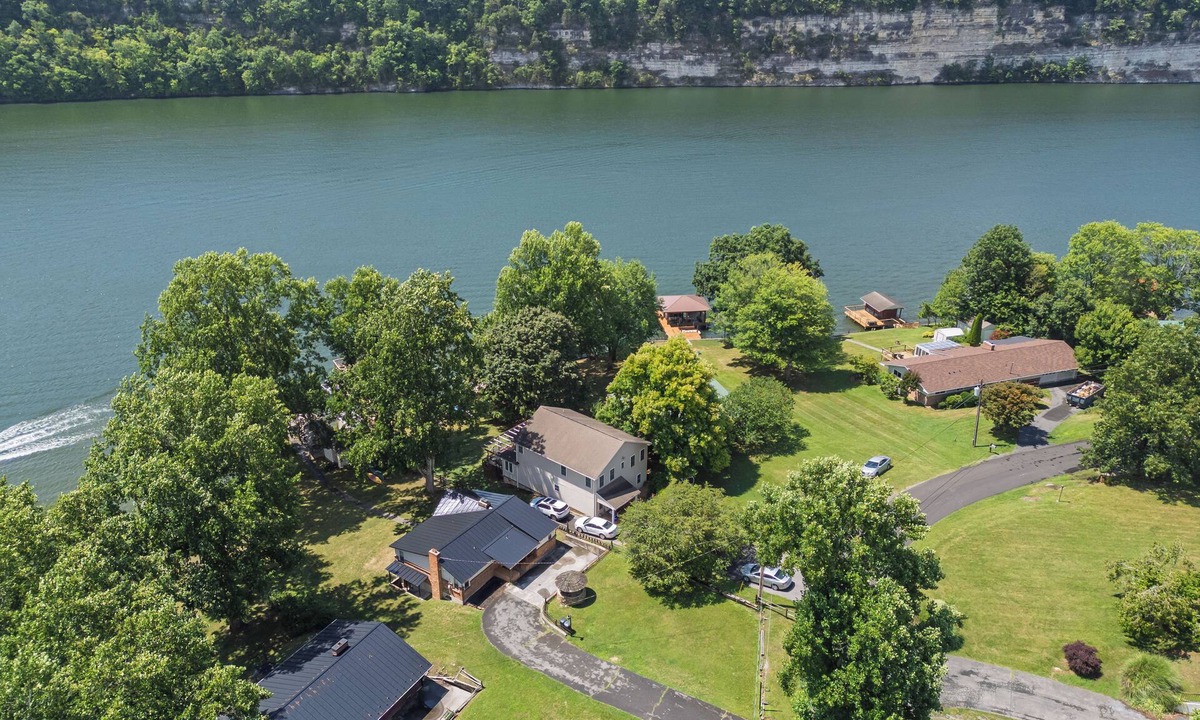 Ingles House | Lakefront retreat with private dock, open living, fire pit, full kitchen & cozy indoor spaces