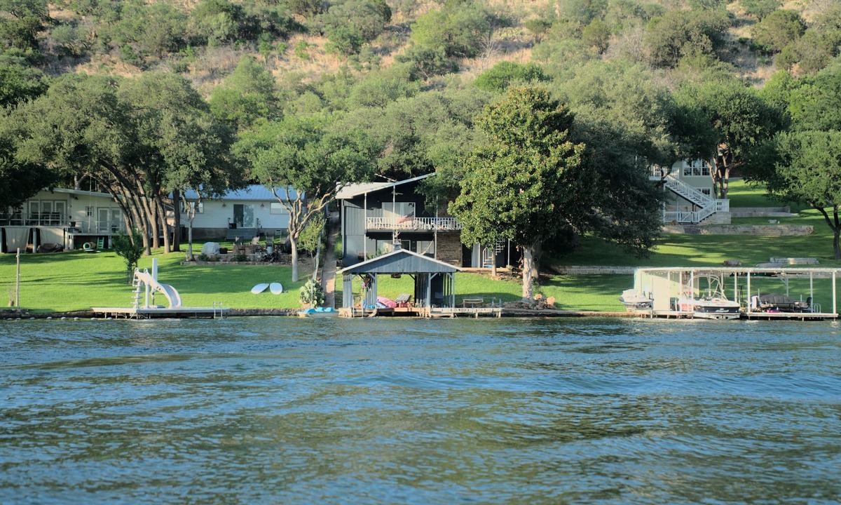 Sunrise Beach Village House | Lakefront retreat on quiet cove with large deck and sweeping views.