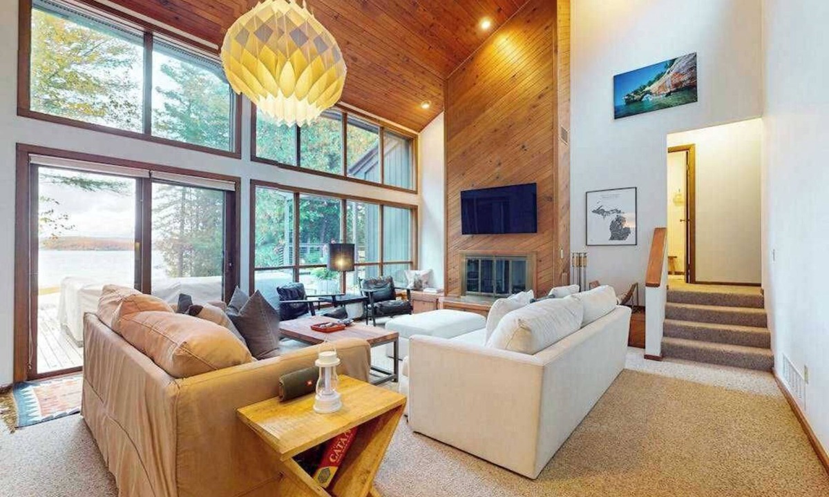 Eveline Township House | Lakeside luxury Home, dock, firepit, near town!
