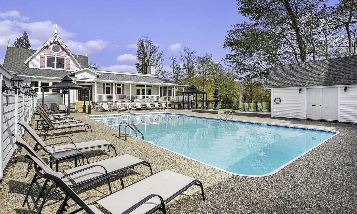 Fennville House | Large family friendly compound, heated pool, and Indoor Basketball court