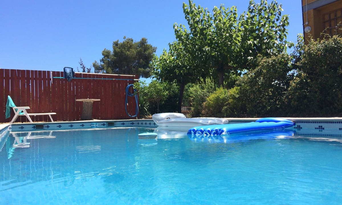 El Catllar Apartment | Large private pool, entire new build cool airy flat, gardens, parking, WiFi