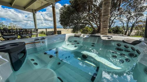 Te Kopuru Villa | Large riverfront home with spa and stage