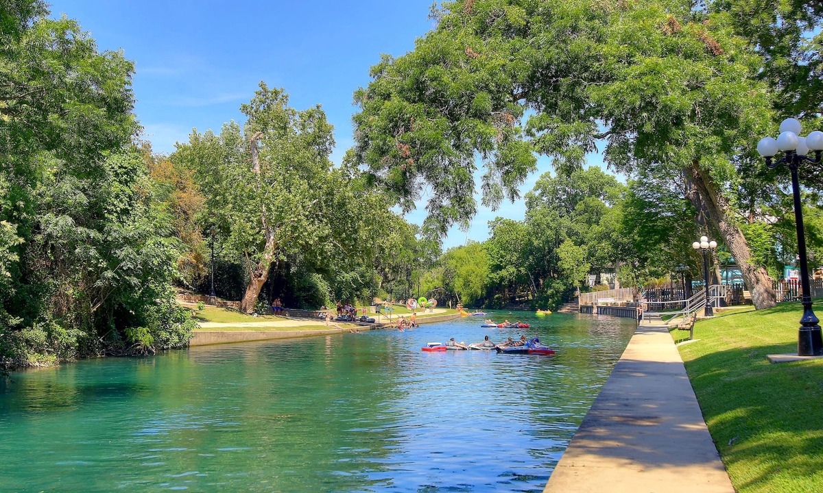 New Braunfels Condo | Located right on the Comal River! Pool, hot tub, direct river access!