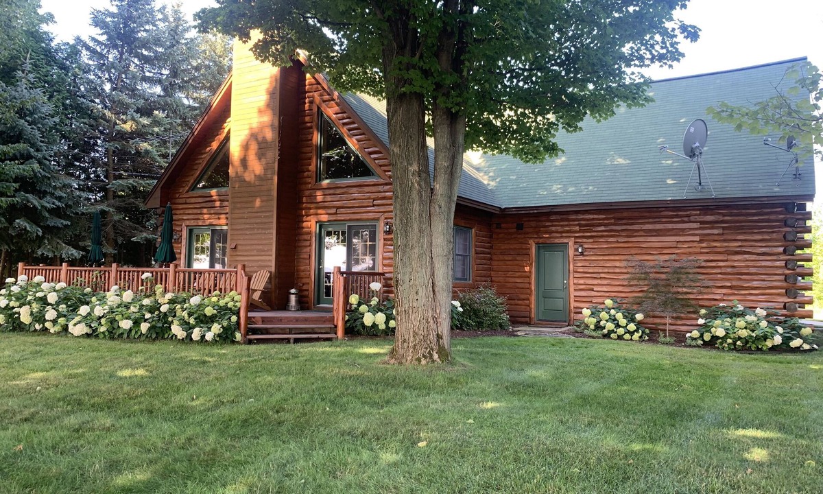 Kewadin House | Log home overlooking Torch Lake