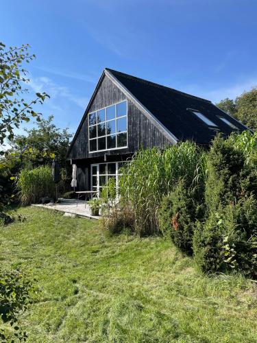 Øer Strand House | Lovely Beach Home Enveloped In Green Surroundings