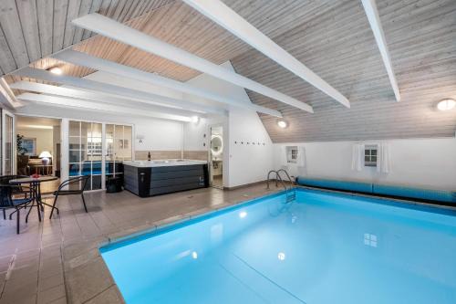 Øhuse House | Lovely Pool House With Jumping Cushion And Activity Room