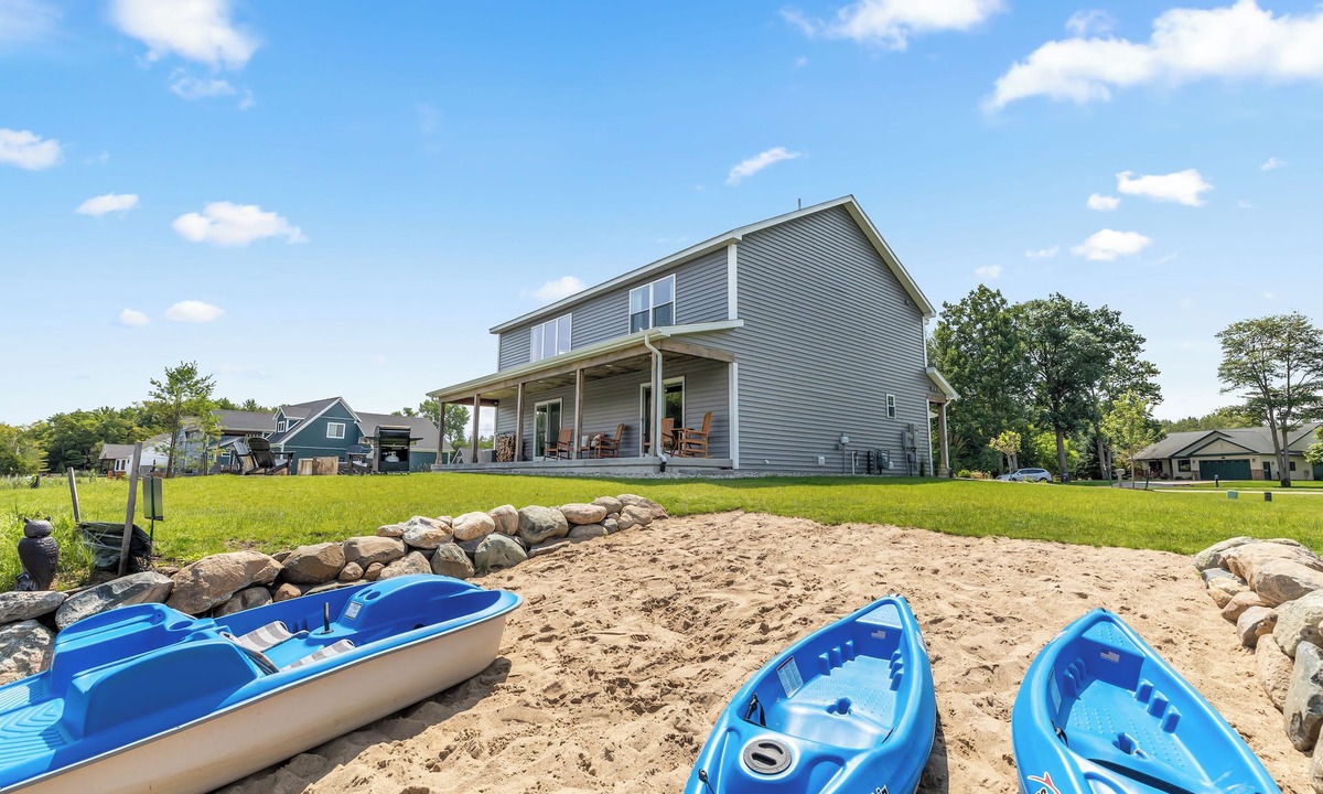 Houghton Lake House | Lux canalfront home. Firepit, kayaks,paddleboat, 20 foot dock, chefs kitchen!