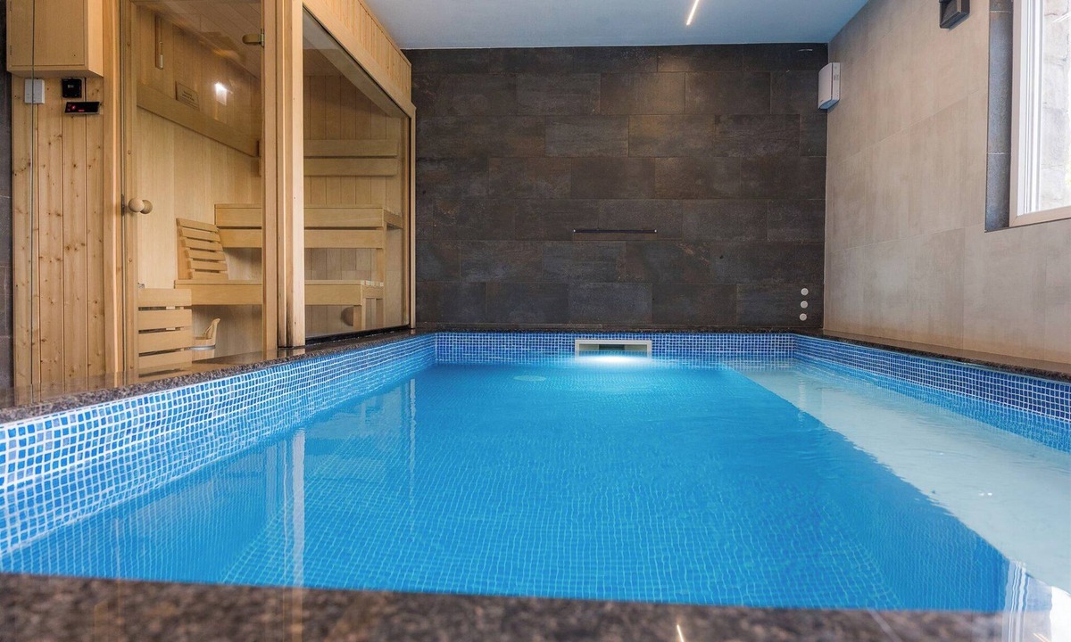 Barilovic House | Luxurious riverside retreat with pool, sauna, jacuzzi, and panoramic nature views.