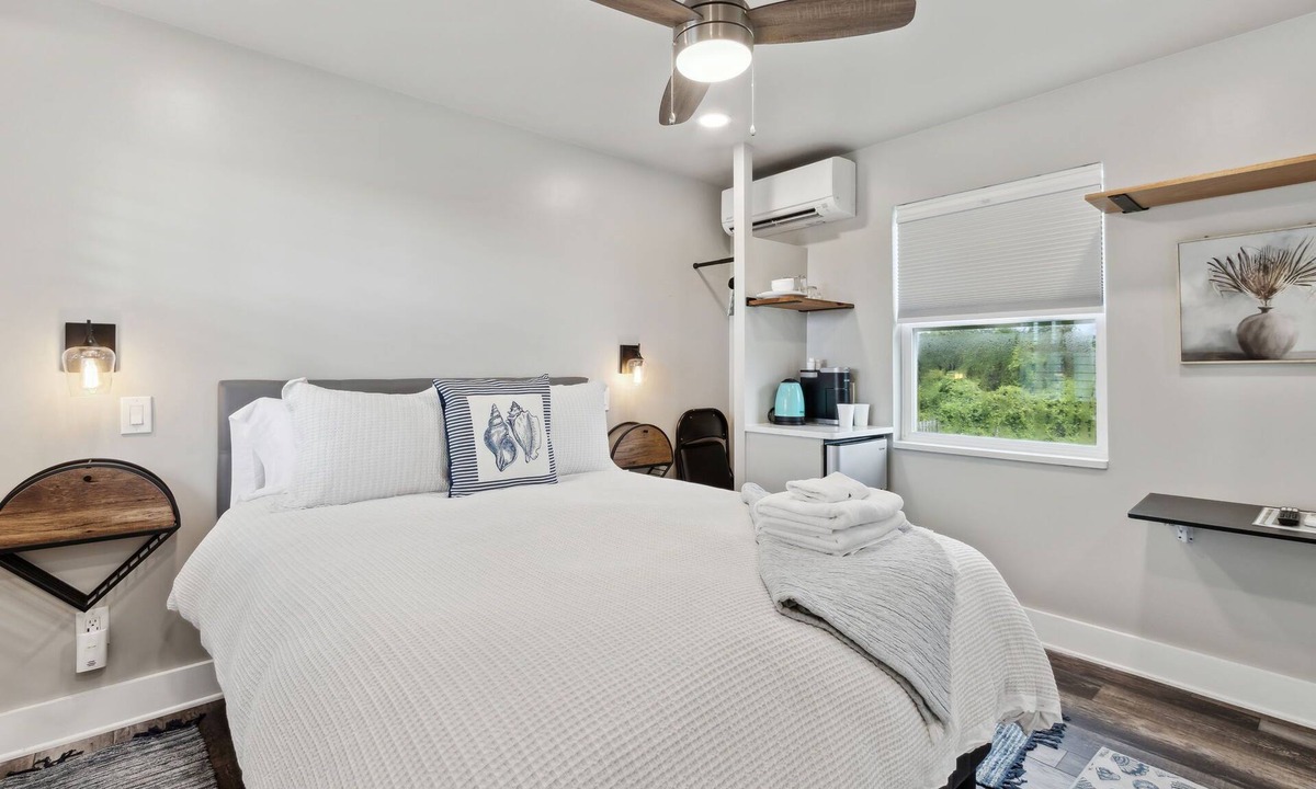 Ocean Cay Apartment | Luxury Studio Steps to Beach Kitchenette Outdoor Seating Partial View Upstairs