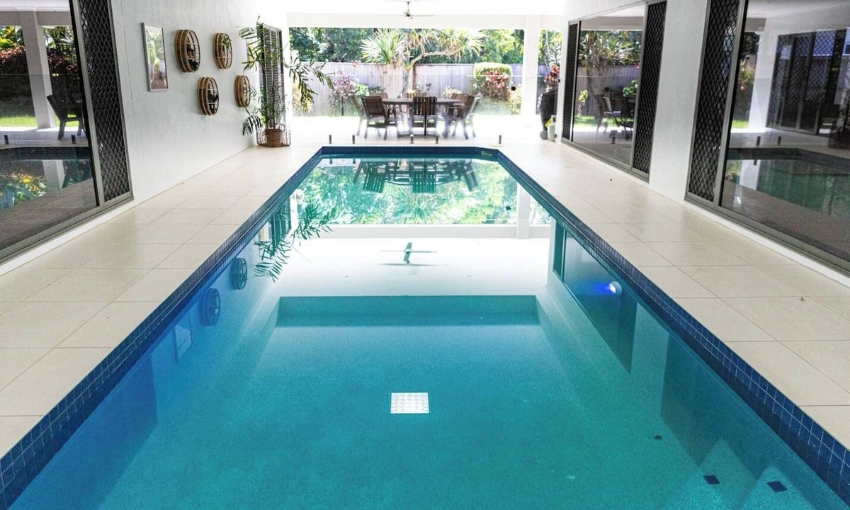 Trinity Beach Villa | Luxury Tropical Escape: Beachside Villa with Heated Pool & Modern Comforts