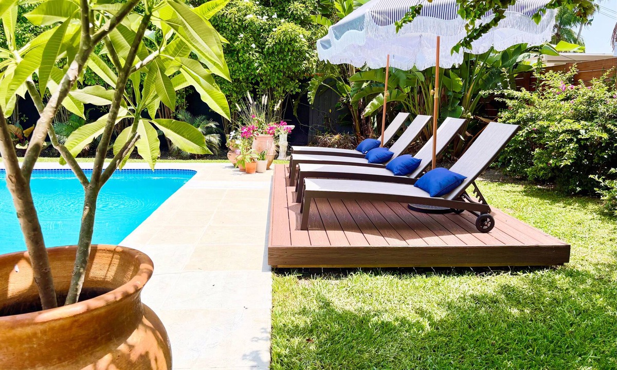Central Corals House | Marigold House - Tropical Getaway w/large yard & heated pool 2 mi from the beach
