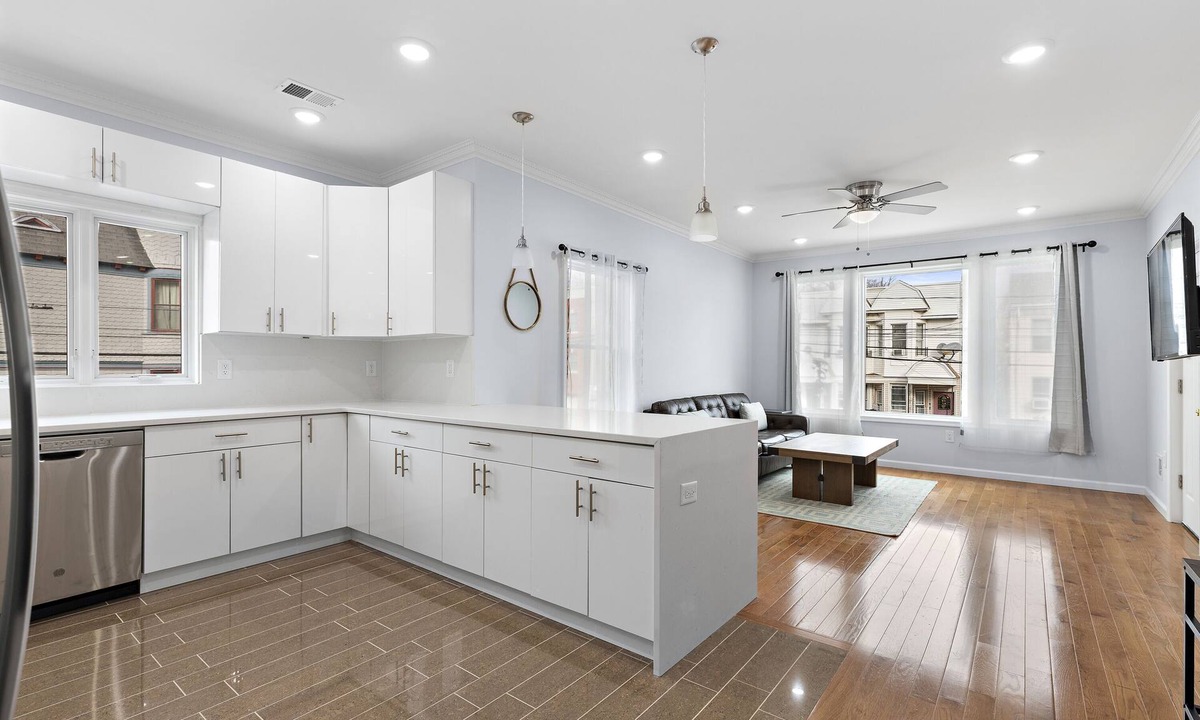 McGinley Square Apartment | Massive 4-bedroom, 3-bathroom apartment with shared yard & bonus garage parking