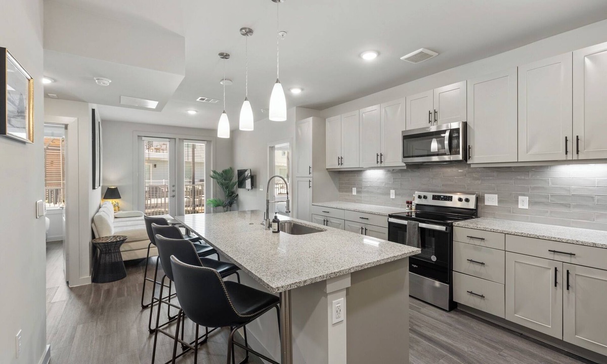 Windsor Park Apartment | Modern 2BR Poolside Patio Suite in North Austin