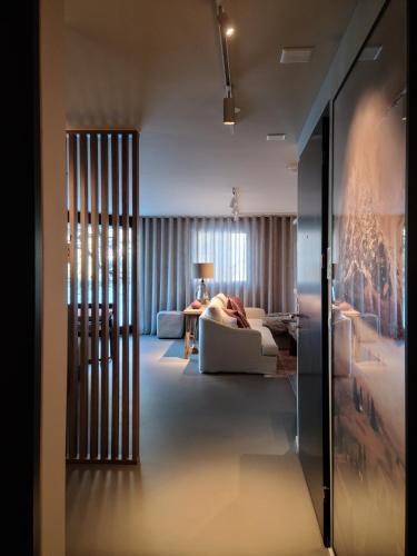 Flims Apartment | Modern Alpine Retreat Garden and Panoramic Views