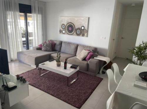 Torre de la Horadada Apartment | Modern apartment 250m from the sea with parking space behind gate