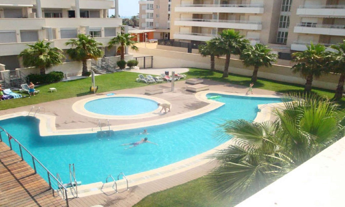 Denia Apartment | Modern apartment on the beach with large communal pool, fitness, air conditioning