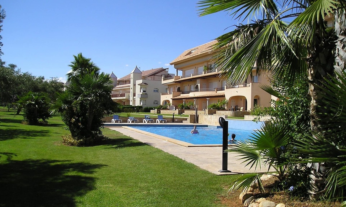 San Jorge House | Modern duplex house overlooking communal pool and gardens at Golf Panoramica.